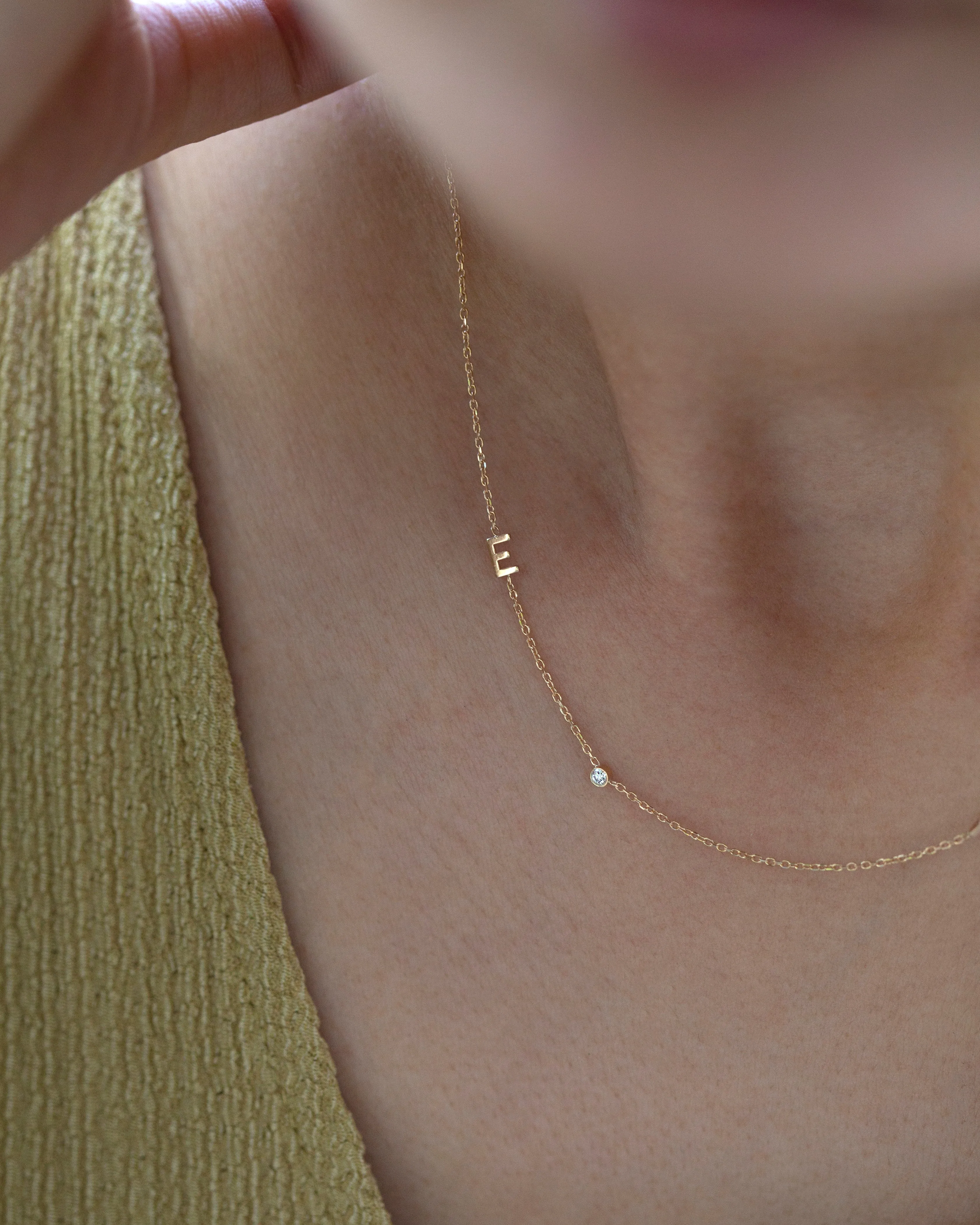 14k gold letter necklace with small diamond