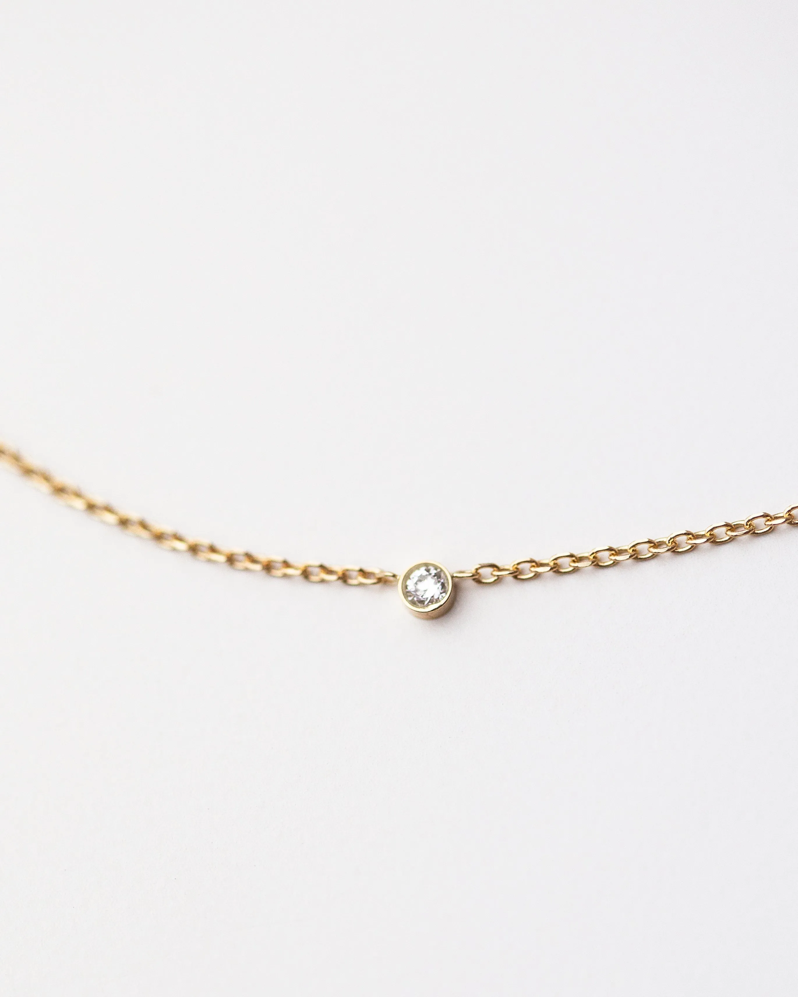 14k gold letter necklace with small diamond