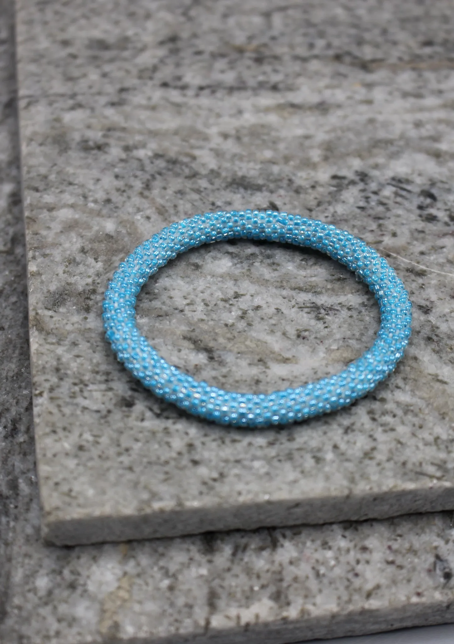 Shiny Light Blue Beads Nepalese Roll on Bracelet